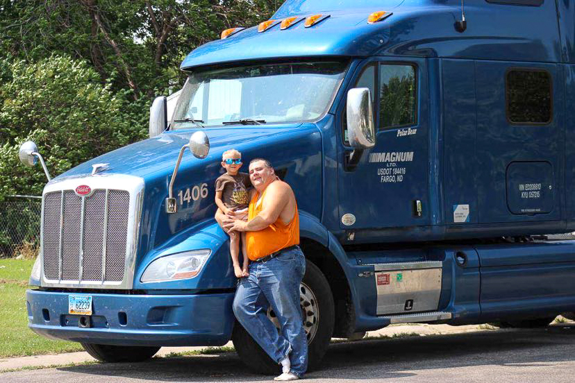 OTR Driver Adam in front of Truck